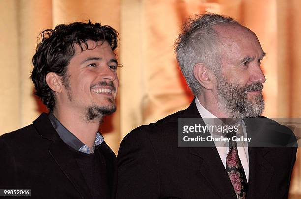 Actors Orlando Bloom and Jonathan Pryce speak onstage before the screening of "Pirates of the Caribbean: The Curse of the Black Pearl" during AFI &...