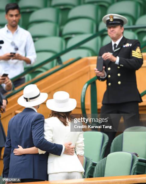 John Vosler and Emma Watson attend day twelve of the Wimbledon Tennis Championships at the All England Lawn Tennis and Croquet Club on July 14, 2018...