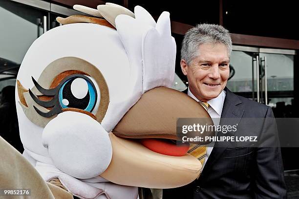 Australian Foreign Minister Stephen Smith poses with the mascot of the Australian pavilion during its offical inauguration at the site of the World...