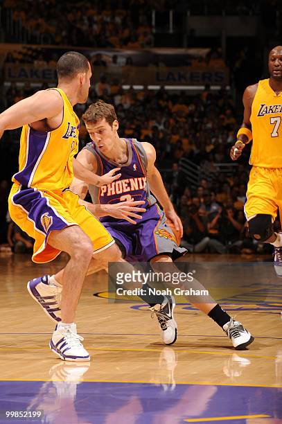 Goran Dragic of the Phoenix Suns handles the ball against Jordan Farmar of the Los Angeles Lakers in Game One of the Western Conference Finals during...