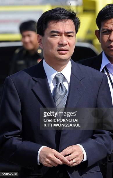 Thai Prime Minister Abhisit Vejjajiva arrives for a weekly cabinet meeting at a military base in Bangkok on May 18, 2010. Thousands of...