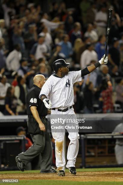 Marcus Thames of the New York Yankees hits a two-run walk off home run in the ninth inning to beat the Boston Red Sox on May 17, 2010 at Yankee...