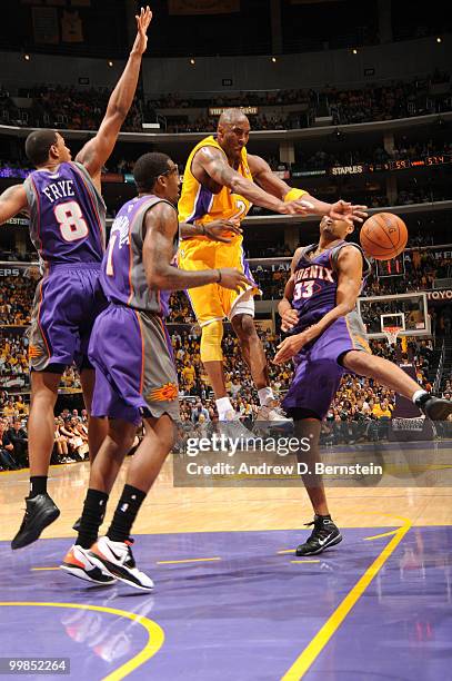 Kobe Bryant of the Los Angeles Lakers mishandles the ball against Channing Frye, Amar'e Stoudemire, and Grant Hill of the Phoenix Suns in Game One of...