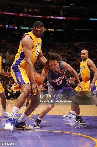 Steve Nash of the Phoenix Suns mishandles the ball against DJ Mbenga of the Los Angeles Lakers in Game One of the Western Conference Finals during...