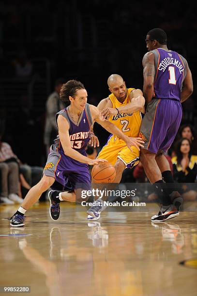 Steve Nash of the Phoenix Suns dribbles against Derek Fisher of the Los Angeles Lakers in Game One of the Western Conference Finals during the 2010...