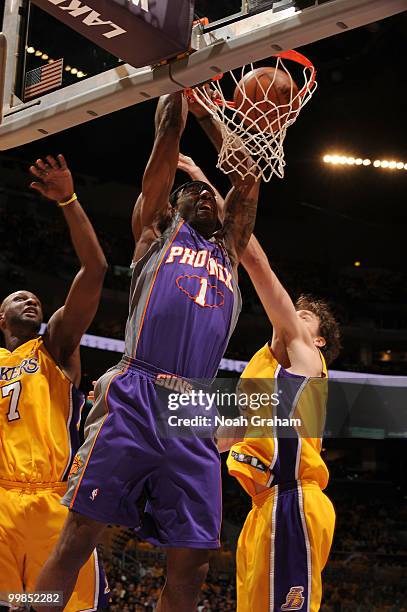 Amar'e Stoudemire of the Phoenix Suns dunks against Lamar Odom and Pau Gasol of the Los Angeles Lakers in Game One of the Western Conference Finals...