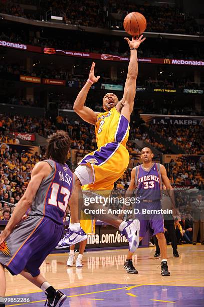 Derek Fisher of the Los Angeles Lakers goes up for a shot against Steve Nash of the Phoenix Suns in Game One of the Western Conference Finals during...