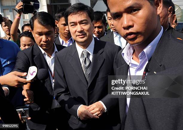 Thai Prime Minister Abhisit Vejjajiva arrives for a weekly cabinet meeting at a military base in Bangkok on May 18, 2010. Thousands of...