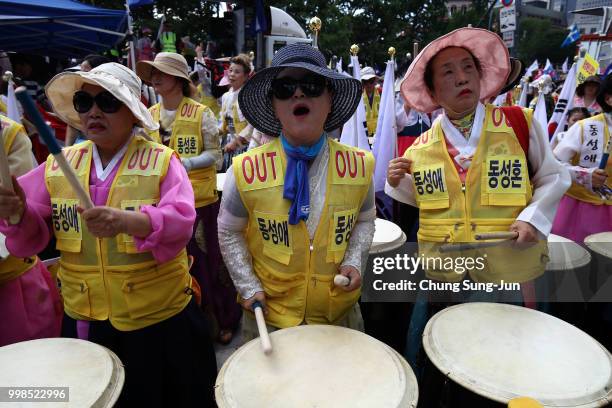 Anti same-sex marriage activists attend the rally next to the Korea Queer Culture Festival 2018 in front of City hall on July 14, 2018 in Seoul,...