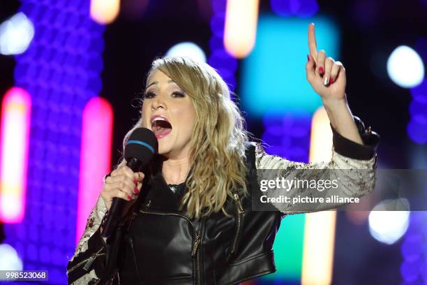 July 2018, Austria, Bad Kleinkirchheim: Melissa Naschenweng performing during the dress rehearsal of the ORF show "Wenn die Musi spielt". The open...