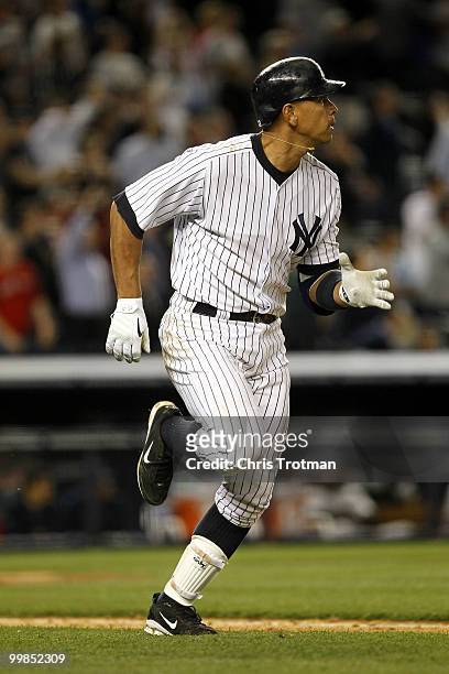 Alex Rodriguez of the New York Yankees watches his two-run home run in the ninth inning against the Boston Red Sox on May 17, 2010 at Yankee Stadium...