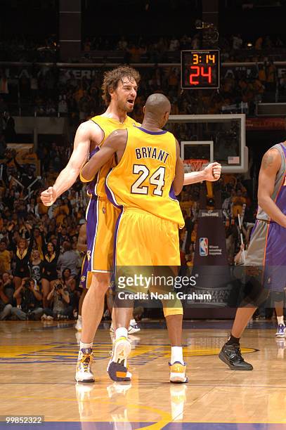 Pau Gasol and Kobe Bryant of the Los Angeles Lakers come together against the Phoenix Suns in Game One of the Western Conference Finals during the...