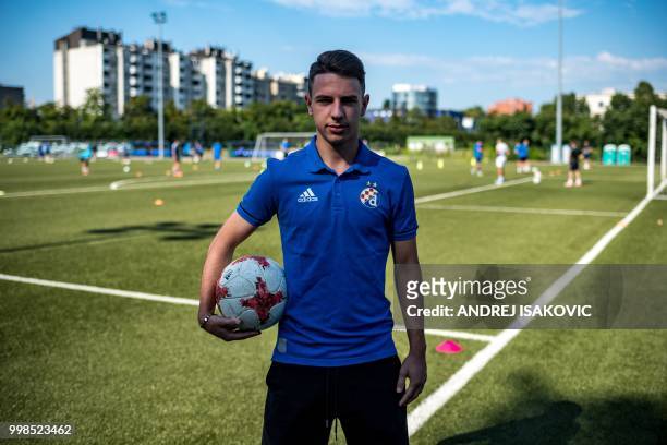 Tomo Alentovic, a young Dinamo Zagreb football club player, poses for a picture during a training session in Zagreb, on July 14, 2018. - Whether it's...