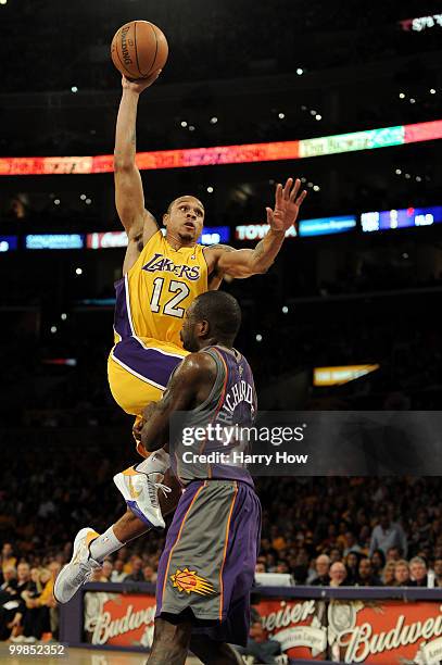 Guard Shannon Brown of the Los Angeles Lakers goes up for a dunk as guard Jason Richardson of the Phoenix Suns defends in Game One of the Western...