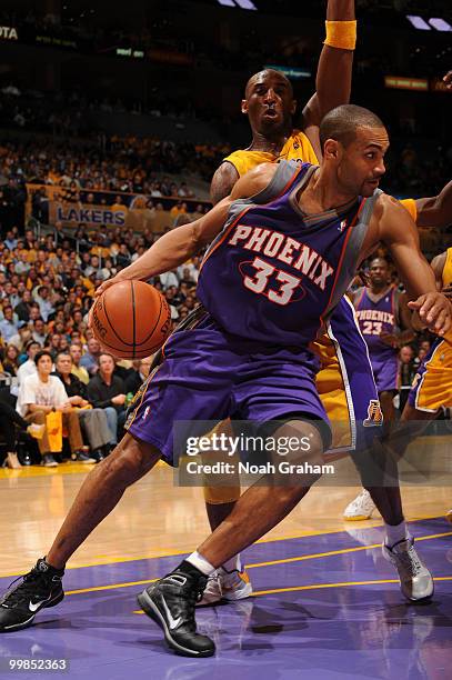 Grant Hill of the Phoenix Suns drives along the baseline against Kobe Bryant of the Los Angeles Lakers in Game One of the Western Conference Finals...