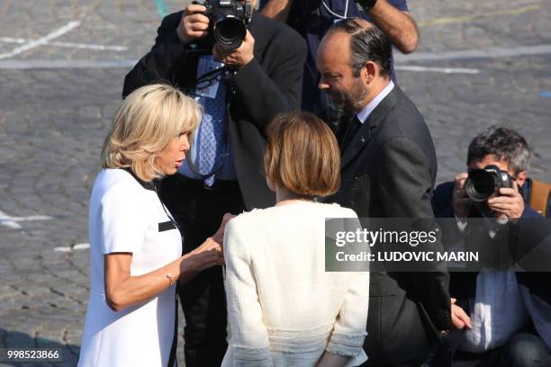 Brigitte Macron , wife of French President, speaks to French Prime Minister Edouard Philippe and French Defence Minister Florence Parly prior to the...