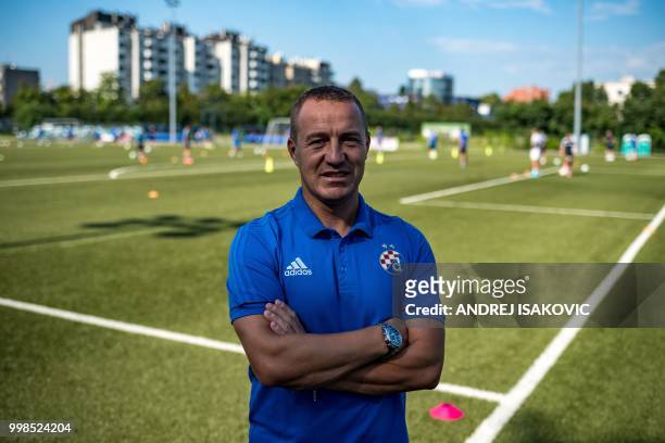 Dino Labdzija, coach of the young categories at Dinamo Zagreb football club, poses for a picture during a training session in Zagreb, on July 14,...