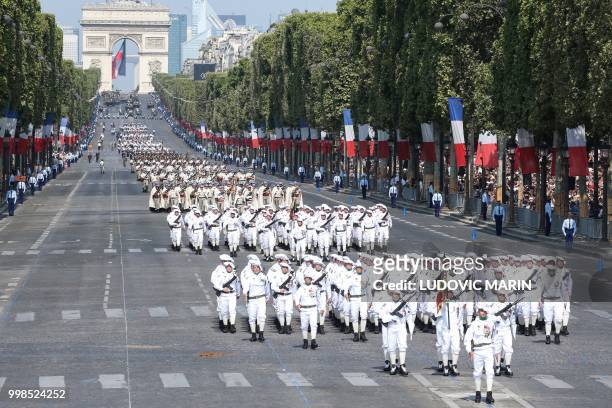 Members of the 4th Regiment de Chasseurs march in front of members of the 93rd Regiment d'Artillerie de Montagne and others during the annual...