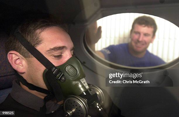 Bulldogs Captain Darren Britt watches on as team mate Brent Sherwin recieves Hyperbaric Chamber treatment for a corked thigh during Bulldogs training...