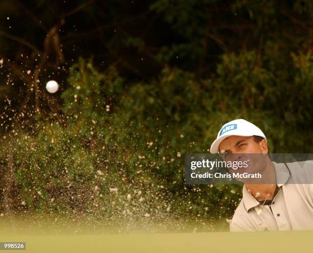 Scott Gardiner of Australia chips out of the bunker on the 14th green during the second round of the Holden Australian Open Golf Tournament held at...