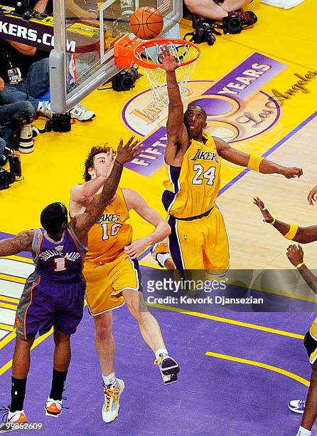 Kobe Bryant of the Los Angeles Lakers attempts to block a layup by Amar'e Stoudemire Phoenix Suns as teammate Pau Gasol defends during the third...