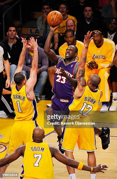 Jason Richardson of the Phoenix Suns shoots a jumper against Jordan Farmar and Shannon Brown of the Los Angeles Lakers in Game One of the Western...