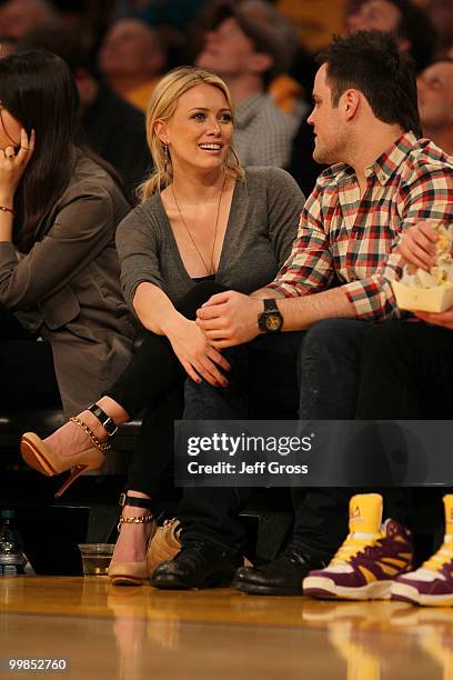 Actress Hilary Duff and Mike Comrie of the Edmonton Oilers watch the Los Angeles Lakers play the Phoenix Suns in Game One of the Western Conference...