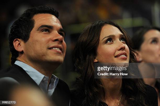Actress Jessica Alba and husband Cash Warren watch the Los Angeles Lakers play the Phoenix Suns in Game One of the Western Conference Finals during...