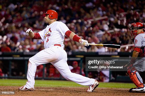 Albert Pujols of the St. Louis Cardinals gets a hit against the Washington Nationals at Busch Stadium on May 17, 2010 in St. Louis, Missouri.