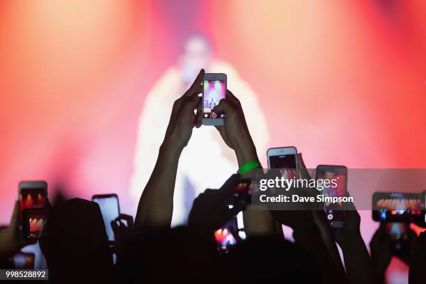 Fans raise their phones to capture Miguel performing during his 'War & Leisure' tour at Logan Campbell Centre on July 14, 2018 in Auckland, New...