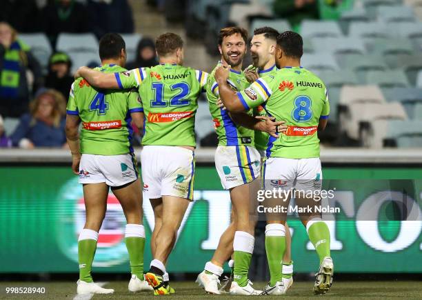 Jordan Rapana of the Raiders celebrates scoring with team mates during the round 18 NRL match between the Canberra Raiders and the North Queensland...