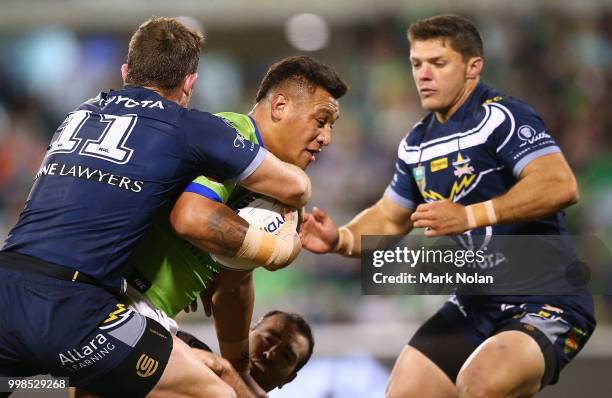 Joshua Papalii of the Raiders is tackled during the round 18 NRL match between the Canberra Raiders and the North Queensland Cowboys at GIO Stadium...