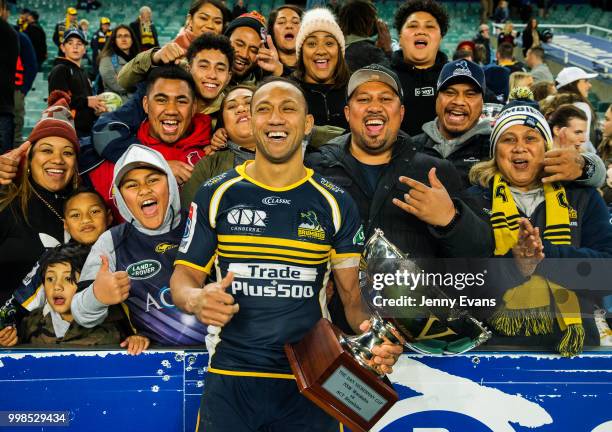 Captain Christian Lealiifano of the Brumbies poses for a portrait with his family after winning the round 19 Super Rugby match between the Waratahs...