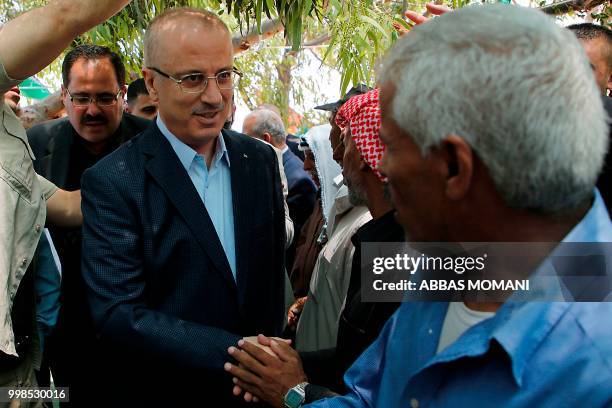 Palestinian Prime Minister Rami Hamdallah visits the Bedouin village of Khan al-Ahmar, in the occupied West Bank on July 14, 2018. - Israel's supreme...