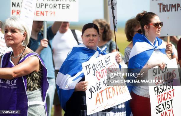 Protestors against the UK visit of US President Donald Trump gather outside his golf course, Trump International Golf Links near Aberdeen, Scotland...