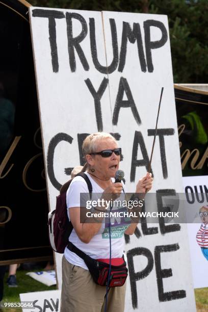 Protestor against the UK visit of US President Donald Trump speaks outside his golf course, Trump International Golf Links near Aberdeen, Scotland on...