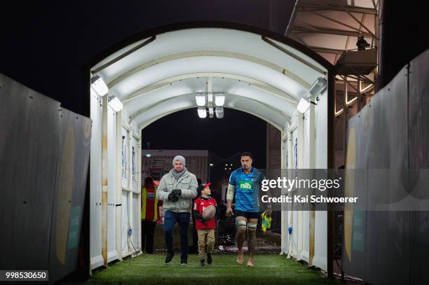 Jerome Kaino of the Blues leaves the field together with former All Black Corey Flynn after his last Super Rugby match during the round 19 Super...