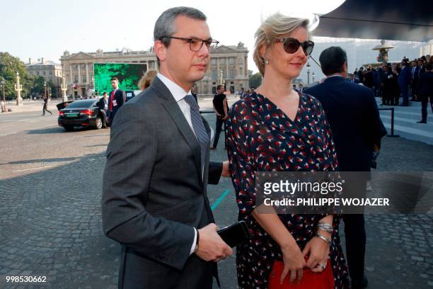 French president's chief of staff Alexis Kohler and his wife Sylvie Schirm arrive to attend the annual Bastille Day military parade on the...