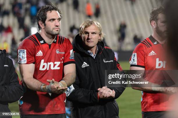 Captain Samuel Whitelock of the Crusaders and Head Coach Scott Robertson of the Crusaders react after their win in the round 19 Super Rugby match...