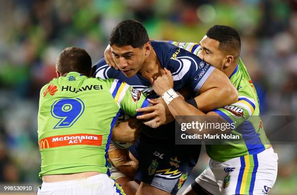 Jason Taumalolo of the Cowboys is tackled during the round 18 NRL match between the Canberra Raiders and the North Queensland Cowboys at GIO Stadium...