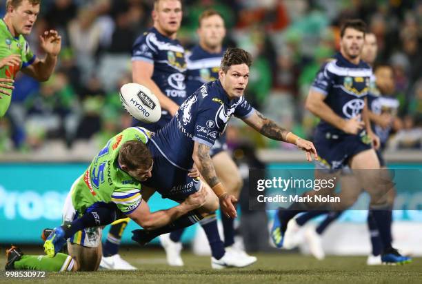 Benjamin Hampton of the Cowboys offloads during the round 18 NRL match between the Canberra Raiders and the North Queensland Cowboys at GIO Stadium...