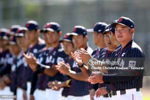 Manager Tsutomu Ikuta of Japan and his team hear the national anthem during the Haarlem Baseball Week game between Chinese Taipei and Japan at the...