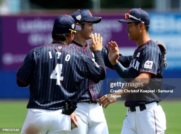 The team of Japan celebrates after winning the Haarlem Baseball Week game between Chinese Taipei and Japan at the Pim Mulier honkbalstadion on July...