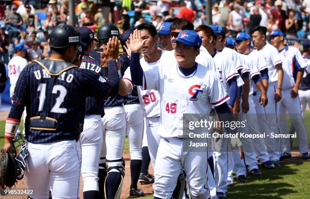 The teams shake hands after the Haarlem Baseball Week game between Chinese Taipei and Japan at the Pim Mulier honkbalstadion on July 14, 2018 in...