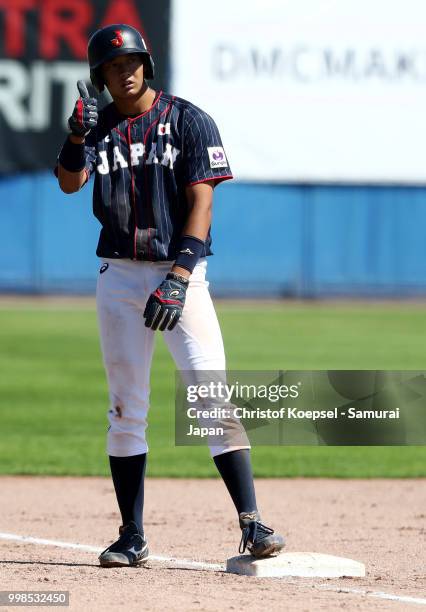 Toshiya Sato of Japan real ts in the forth inning during the Haarlem Baseball Week game between Chinese Taipei and Japan at the Pim Mulier...