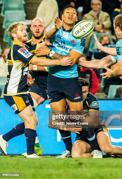 Israel Folau of the Waratahs passes the ball during the round 19 Super Rugby match between the Waratahs and the Brumbies at Allianz Stadium on July...