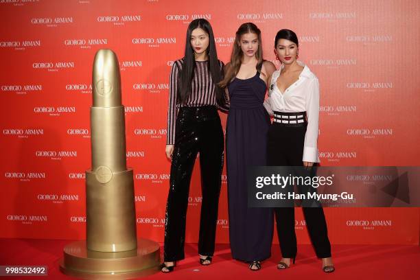 Models Kim Sung-Hee, Barbara Palvin and Nicole Warne attend during a promotional event for the 'GIORGIO ARMANI' Beauty on July 13, 2018 in Seoul,...