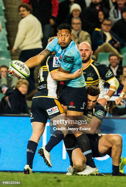 Israel Folau of the Waratahs passes the ball during the round 19 Super Rugby match between the Waratahs and the Brumbies at Allianz Stadium on July...