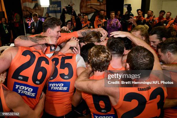 Giants players celebrate victory during the round 17 AFL match between the Greater Western Sydney Giants and the Richmond Tigers at Spotless Stadium...