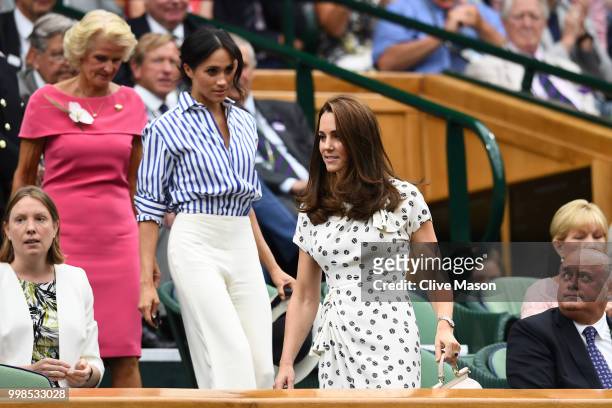 Catherine, Duchess of Cambridge and Meghan, Duchess of Sussex attend day twelve of the Wimbledon Lawn Tennis Championships at All England Lawn Tennis...